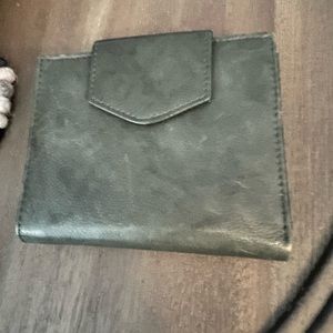 Dark green leather wallet.